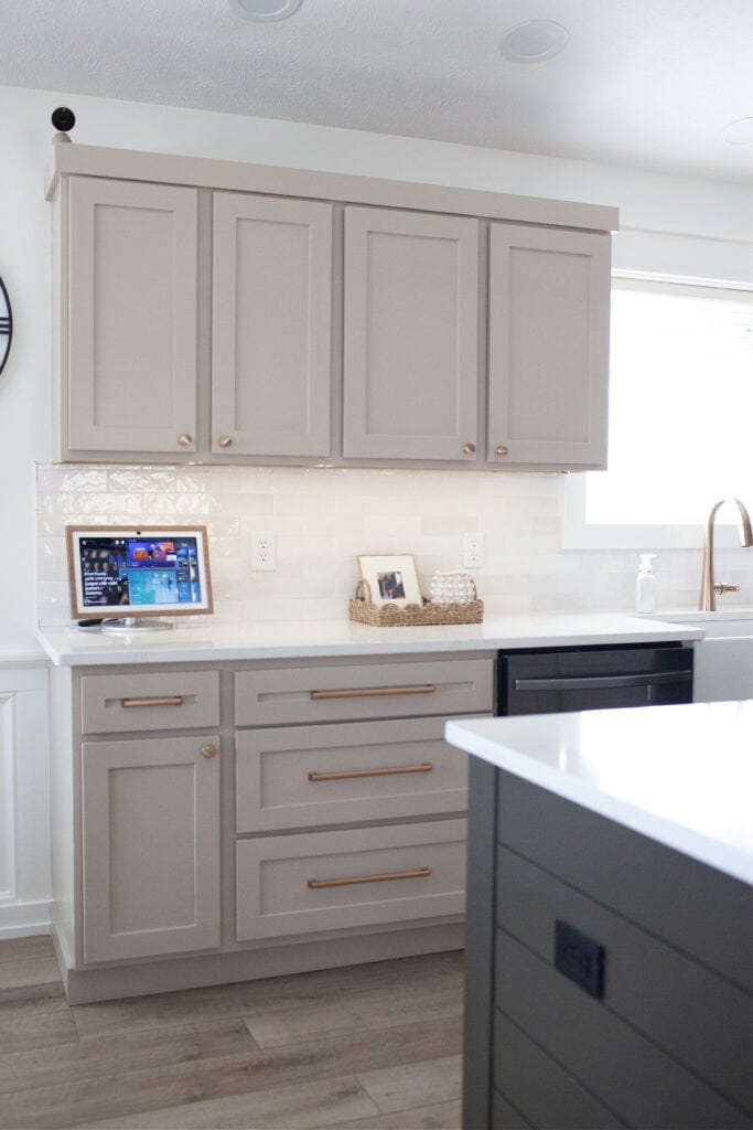 Painted oak wood kitchen cabinets in Sherwin Williams Balanced Beige, Cold Foam walls, Thunder Gray island, Zellige tile similar to cloe bedrosian tile, white quartz countertop, et Calacatta gold, gold hardware