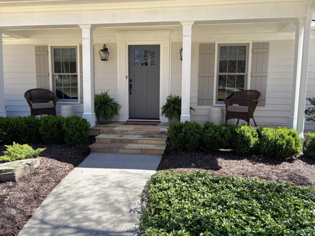 Slate tile patio and steps, exterior siding Classic Gray, front door Charcoal Slate, Sherwin Williams White Snow trim, Asphalt shutters