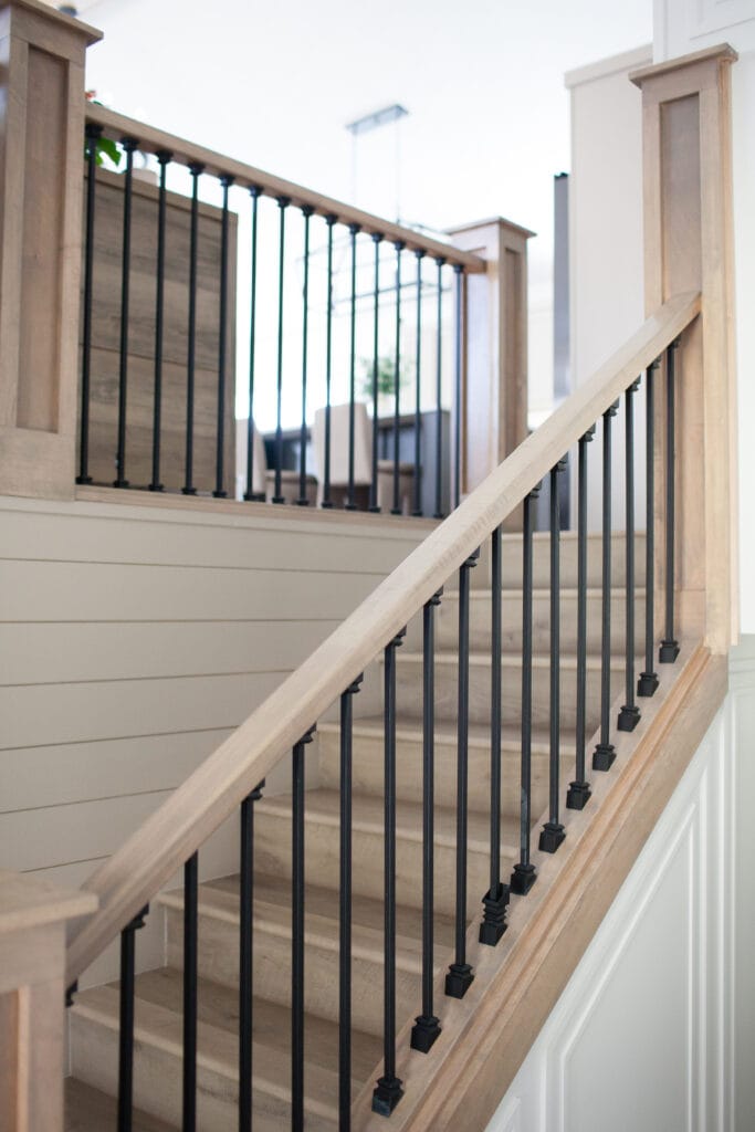 Split level entryway staircase update ideas, shiplap moldings, black spindles, wood railing, wood steps - staircase ideas