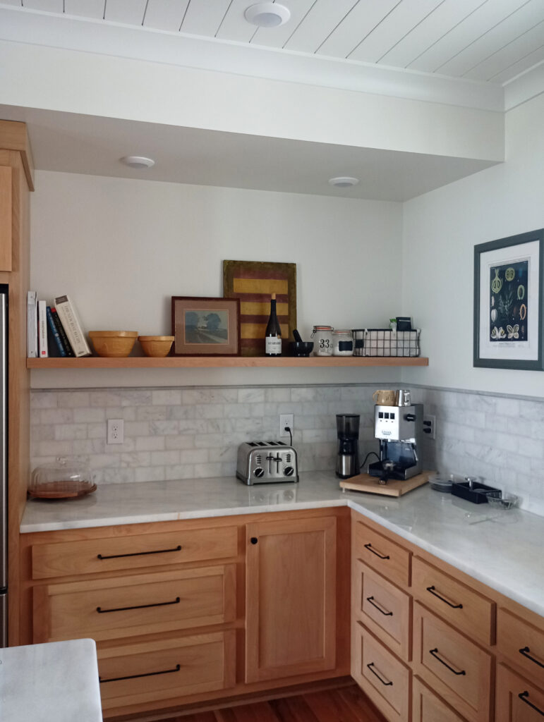 Wood lower cabinets maple or cherry, marble countertop and subway tile backsplash, wood floating shelf, Sherwin Williams Alabaster and Pure White, decor