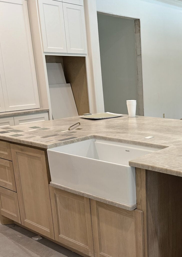 Quartzite kitchen countertop, Perla Bianca, similar to Taj Mahal, white oak stained island with sink. Weathered oak blend (1)
