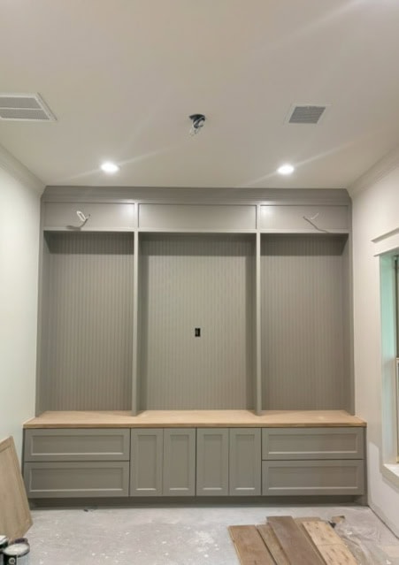 Sherwin Williams Intellectual Gray painted mudroom cabinets with butcherblock wood countertop seat, Alabaster warm white walls
