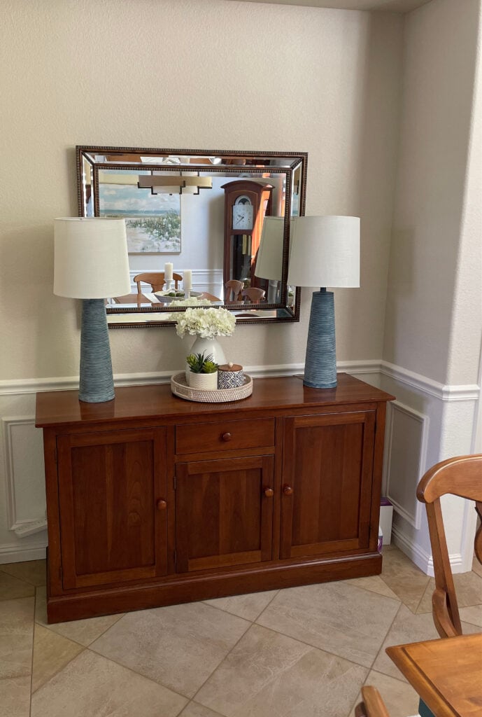 Sherwin Williams Natural Linen with beige tile floor, red chair stained cabinet, Moderate White lightened wainscoting and trim (1)