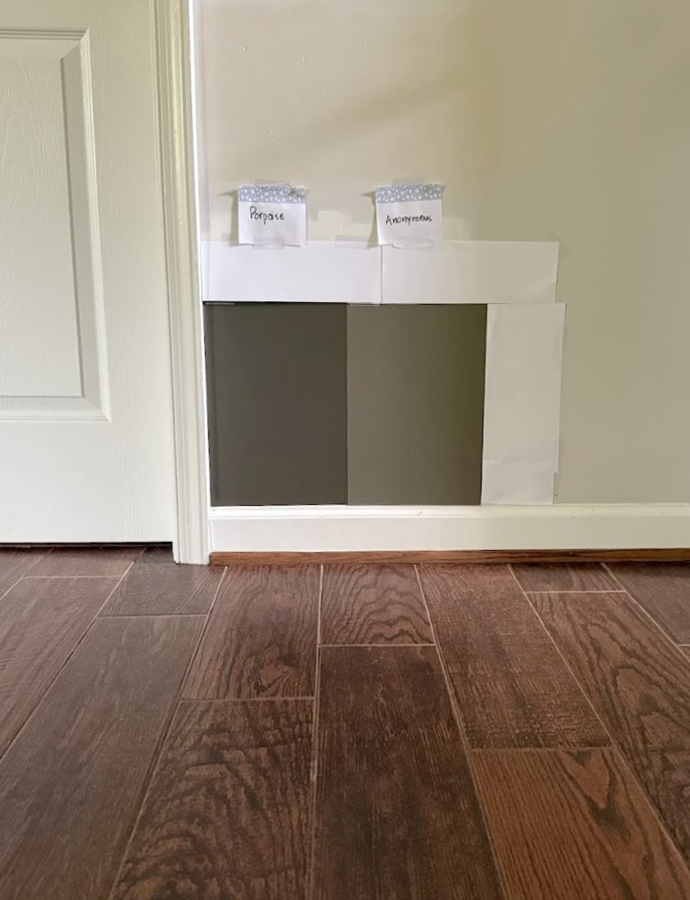 Sherwin Williams Porpoise vs. Anonyoous with red stained wood floor (tile look) and white trim, dark greiges