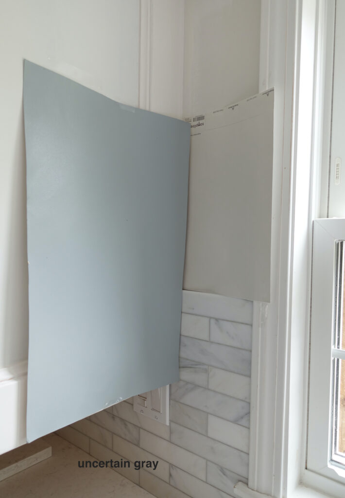 Sherwin Williams Uncertain Gray, gray blue paint color with marble tile backsplash and warm gray walls