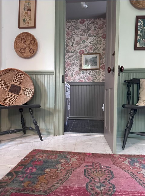 Sherwin Williams Evergreen Fog on beadboard and trim with BEnjamin Moore White Dove walls, looking into a wallpapered powder room