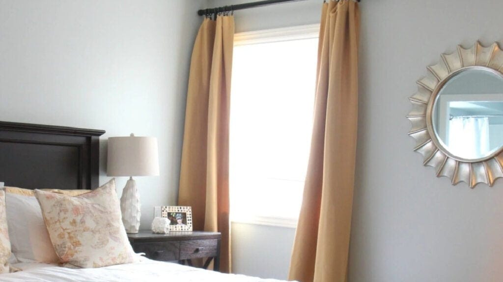 Sherwin Williams Silver Strand in bedroom with gold drapes
