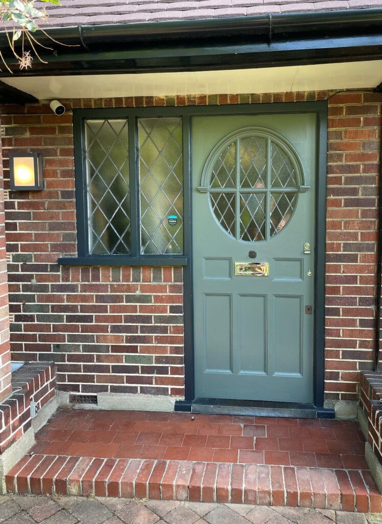 brick external colour in UK, england, london paint color consultation by Kylie M Interiors, green front door in Benjamin Moore Rainy Afternoon, lead windows, dark trim, heritage look home