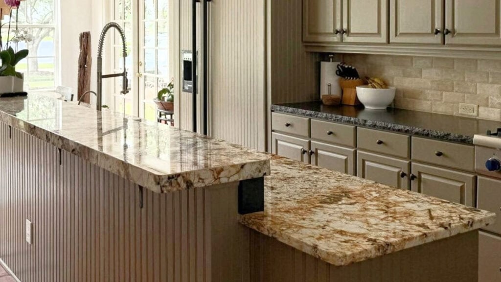 ideas to update older granite countertops in kitchens, shown here is a warm golden countert and travertine backsplsh