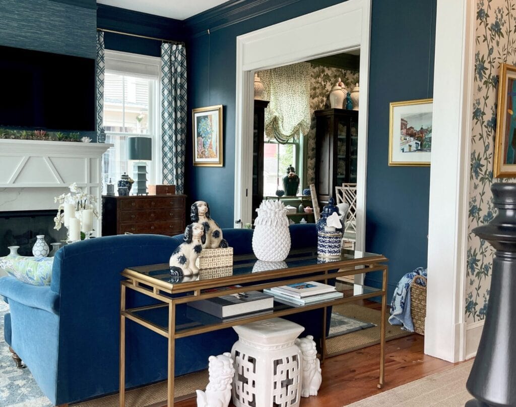 Farrow and Ball Hague Blue, traditional style living room, blue grasscloth, wallpaper, blue velvet sofa, white fireplace and trim