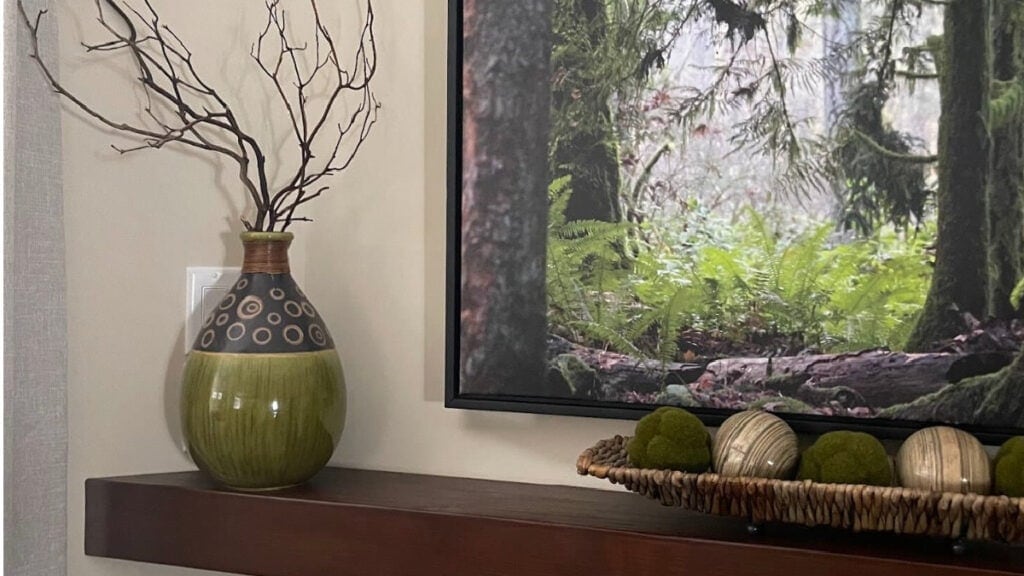 Benjamin Moore Manchester Tan with red stained wood mantel and green accents, east-facing exposure