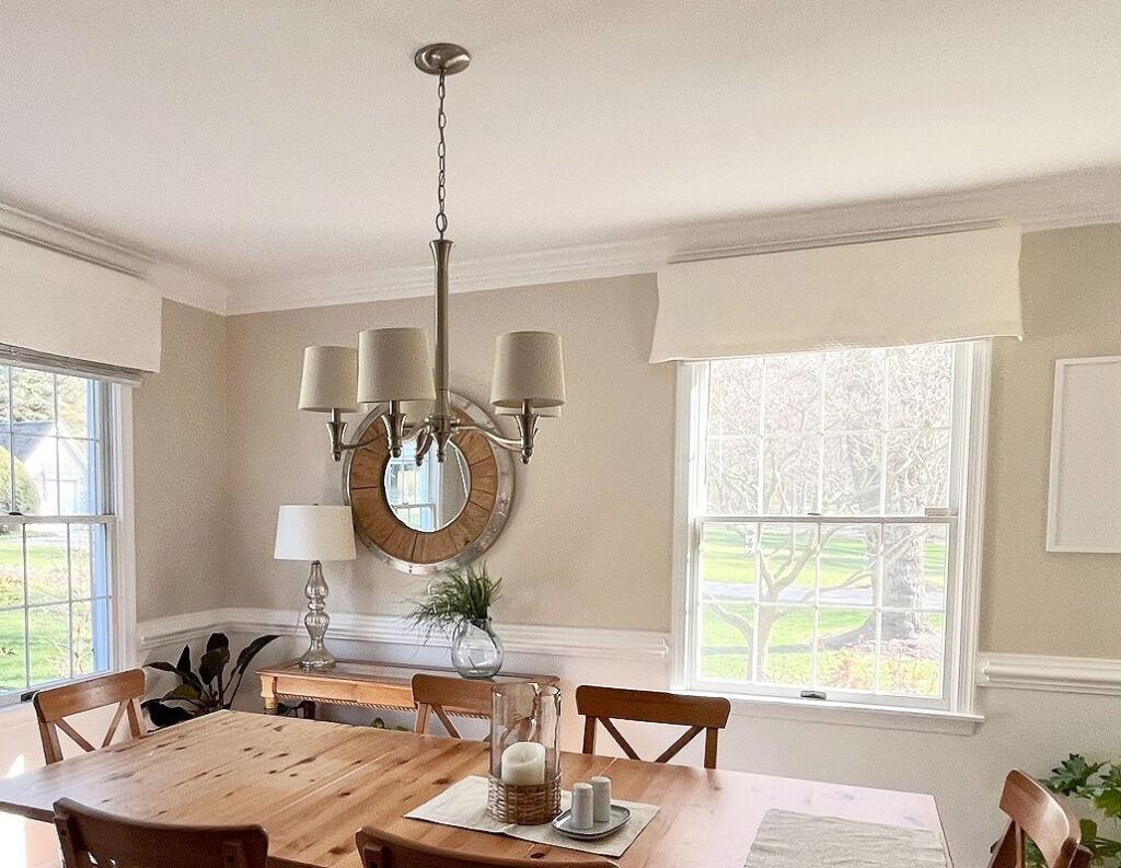 Benjamin Moore Chantilly Lace trim and White Sand (tan) walls in homey dining room