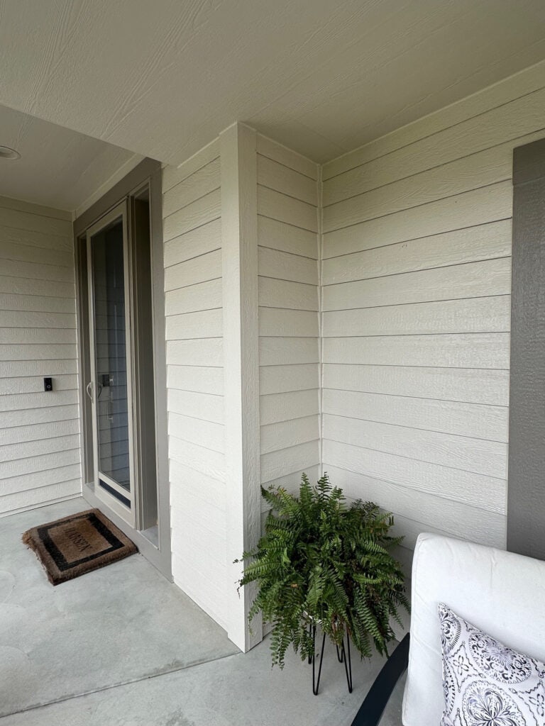 Benjamin Moore Edgecomb Gray on the exterior of a home with Graystone trim, beige taupe tan windows
