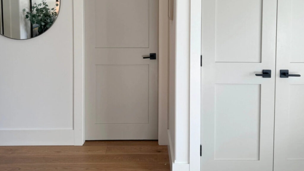 Benjamin Moore Revere Pewter on painted interior door, White Dove trims and walls, white oak flooring in foyer. (1)