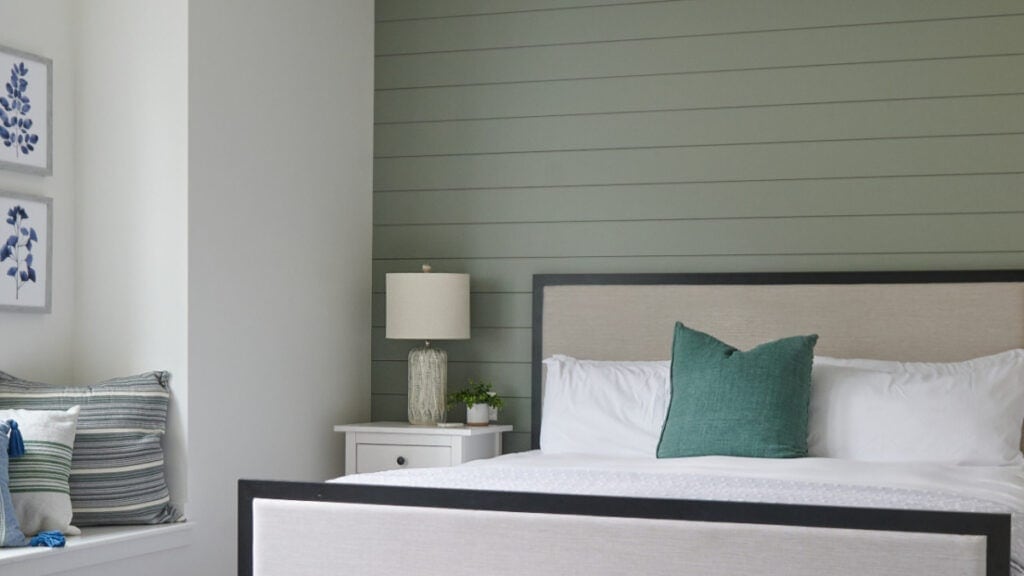 SHERWIN WILLIAMS EVERGREEN FOG ON A SHIPLAP ACCENT WALL IN A BEDROOM