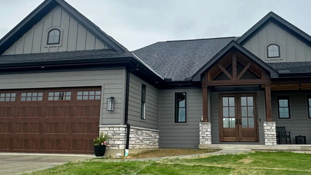 Gauntle Gray exterior, black trim and gutter, stone, dark gray or black roof