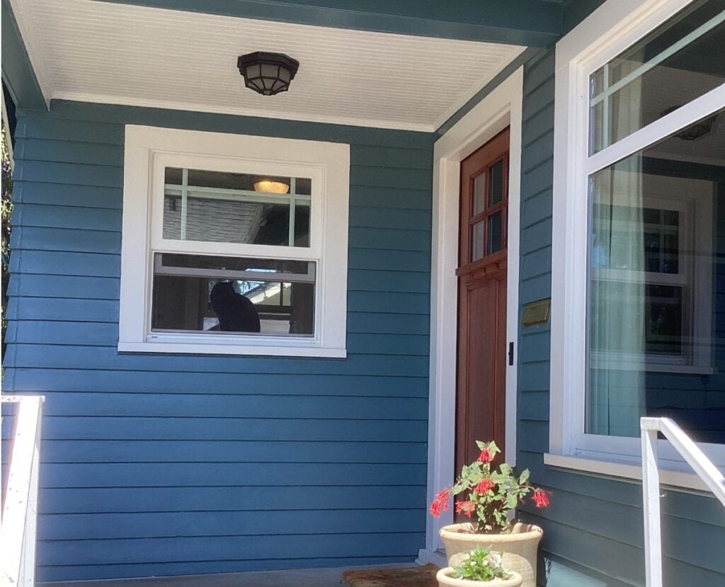 Sherwin Williams Snowbound exterior trim, white windows, blue siding is Sherwin Williams Mediterranean Blue