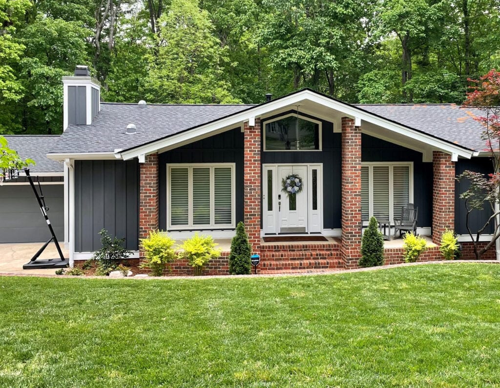 Sherwin Williams Extra White trim, front door, side lights, gray roof, red brick exterior, siding James Hardie Iron Gray, dark green-blue-gray