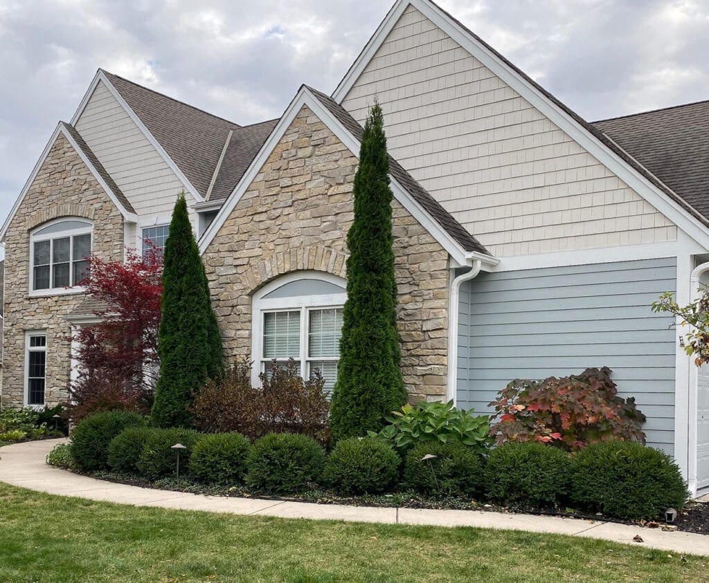 exterior painted, Sherwin Williams Aesthetic white darkened, Mineral Deposit, gray, asphalt roof, stone. White windows