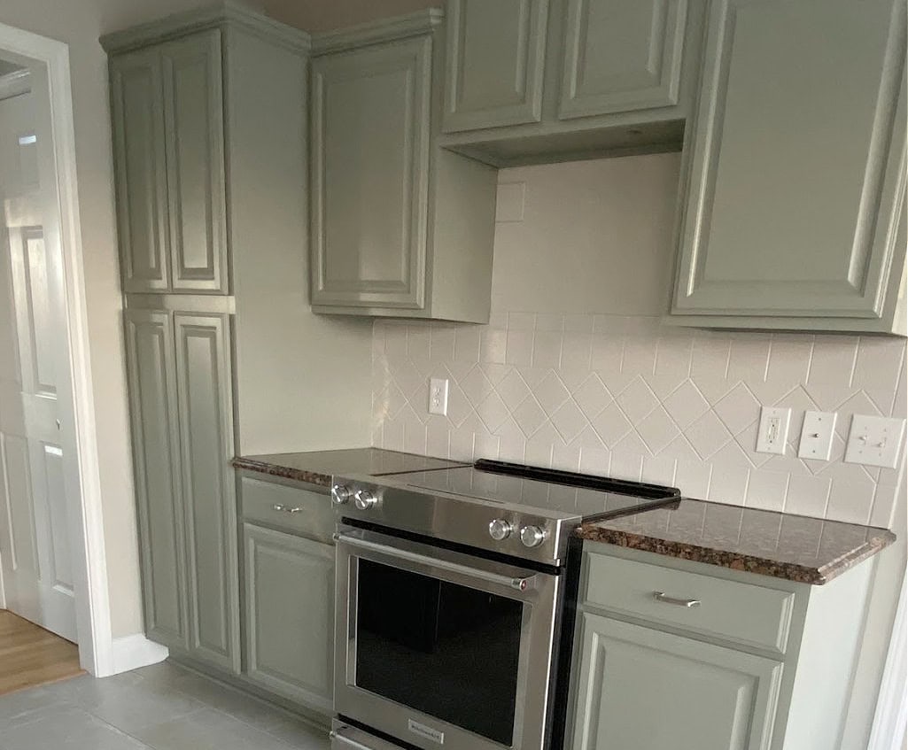 painted green wood kitchen cabinets in Sherwin Williams Cornwall Slate, warm gray tile floor, Baltic Brown granite countertop, painted tile backsplash (1)