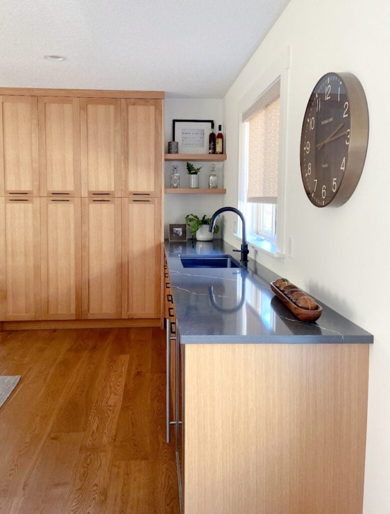 Home bar, golden oak cabinets and flooring, dark gray, marble or soapstone look quartz countertop - Vicostone, White Dove walls and floating shelves