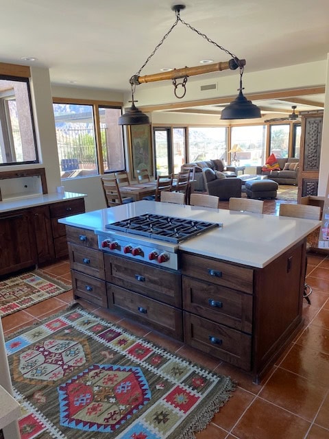 Kitchen with soft white quartz, terracotta tile floor, dark wood stained vanity, wood trim on windows and Natural Linen walls