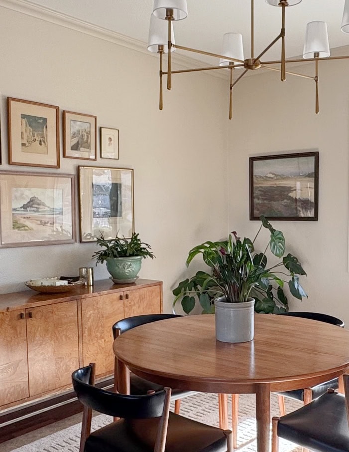 Sherwin Williams Maison Blanche in mid-century style dining room with furniture, home decor and south-facing light. Decorating with plants