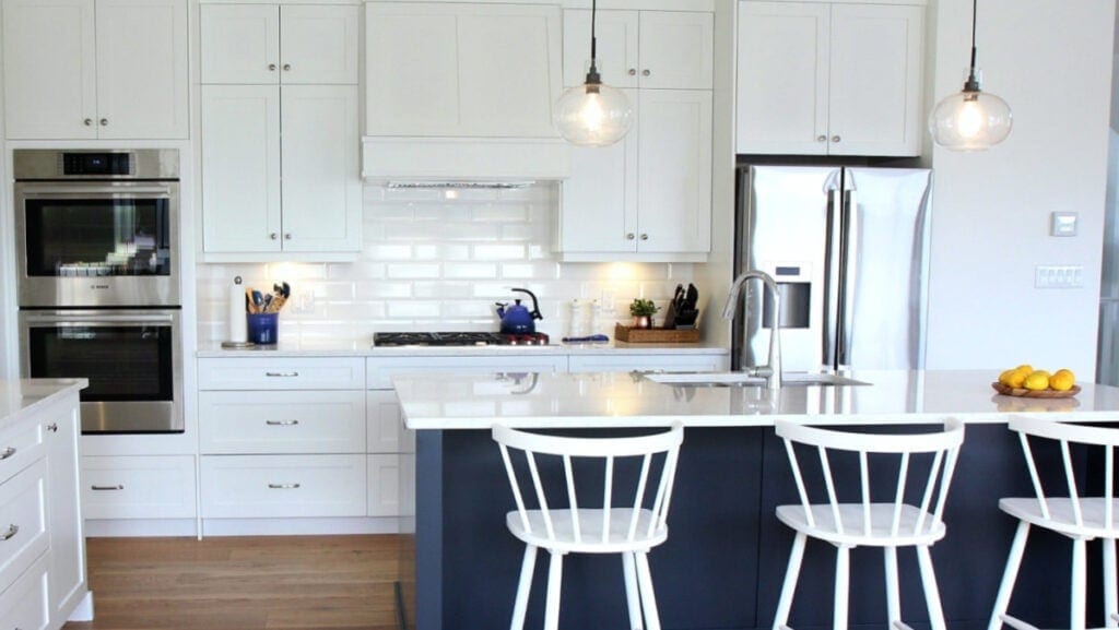 sherwin williams pure white kitchen, cyberspace island, white subway tile backsplash and quartz counters