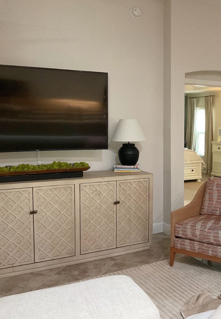 herwin Williams Aesthetic White walls in living room with tv cabinet and tile flooring