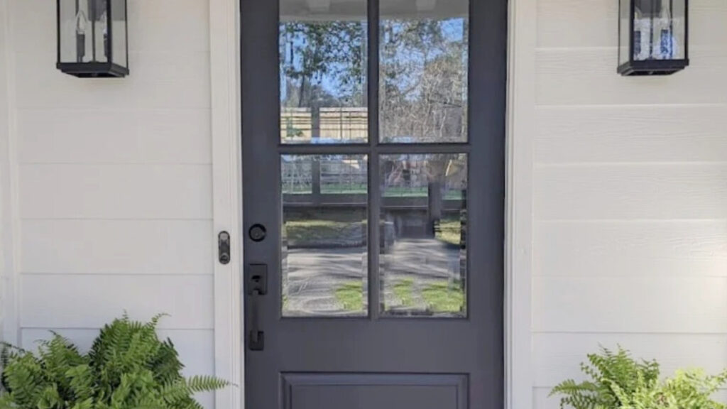 Benjamin Moore Seapearl on exterior painted brick and siding with Cheating Heart on the front door - blue-black