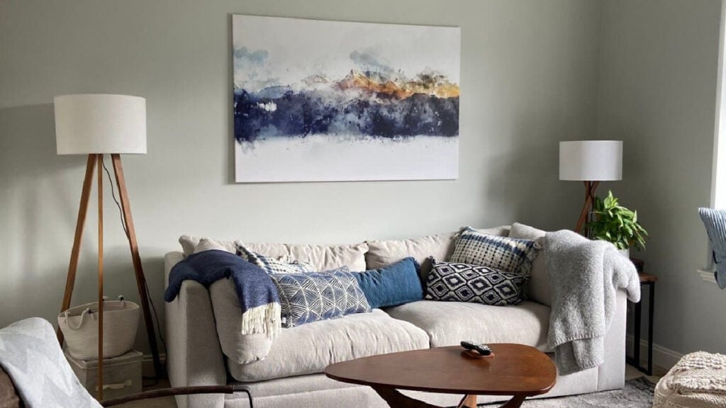 Benjamin Moore Gray Owl on den walls with sofa and blue accents, south-east facing