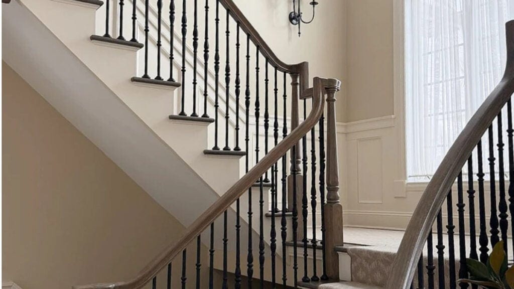 Color similar to Behr beige and tans, this is Benjamin Moore Natural LInen with neutral stair runner and graywash wood railing