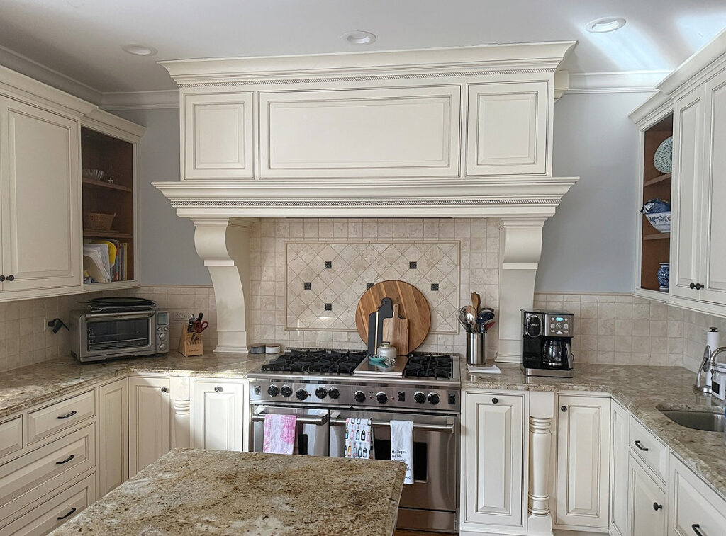 Cream glazed cabinets with granite c